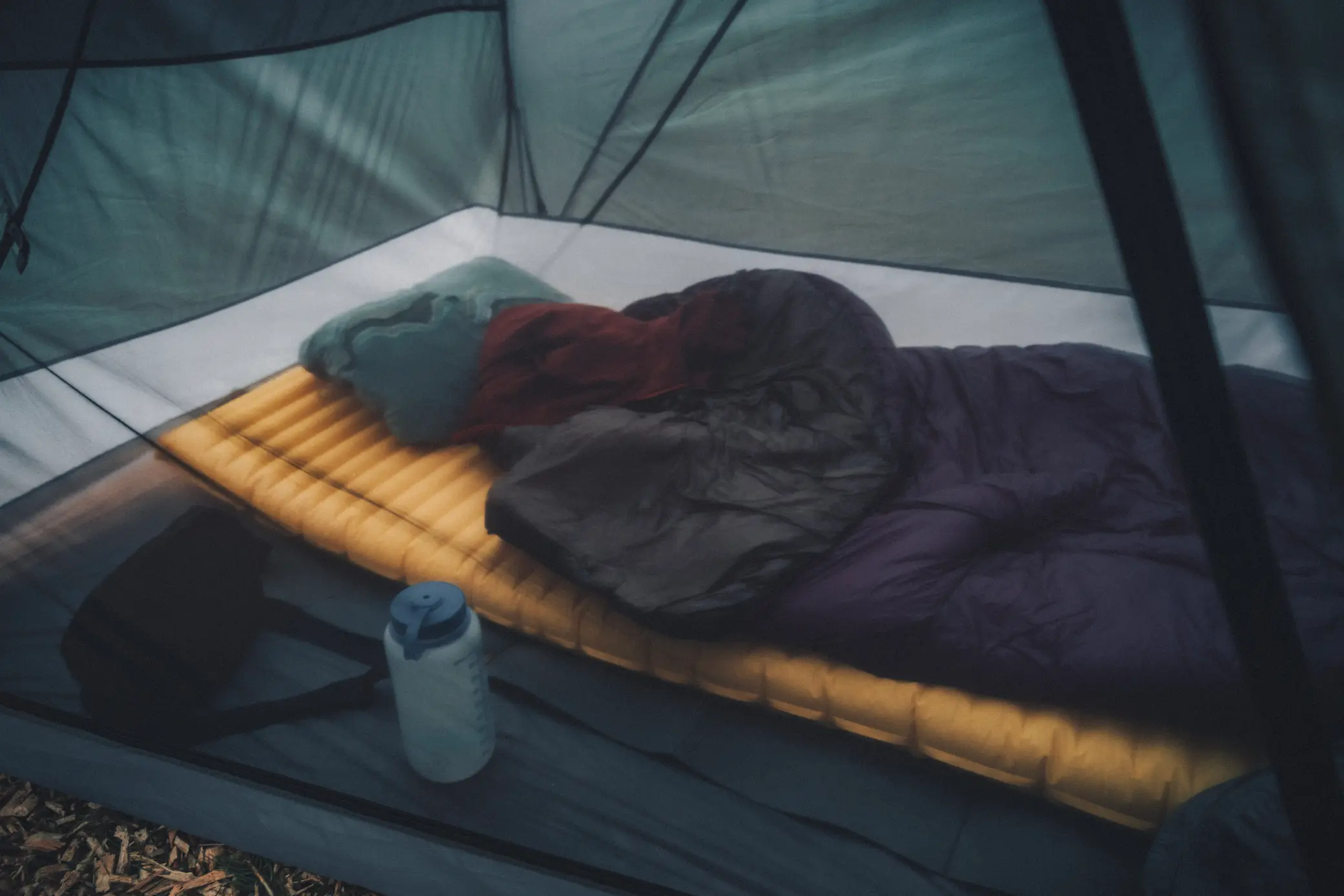 photo of inside of tent with sleeping bag and sleeping pad