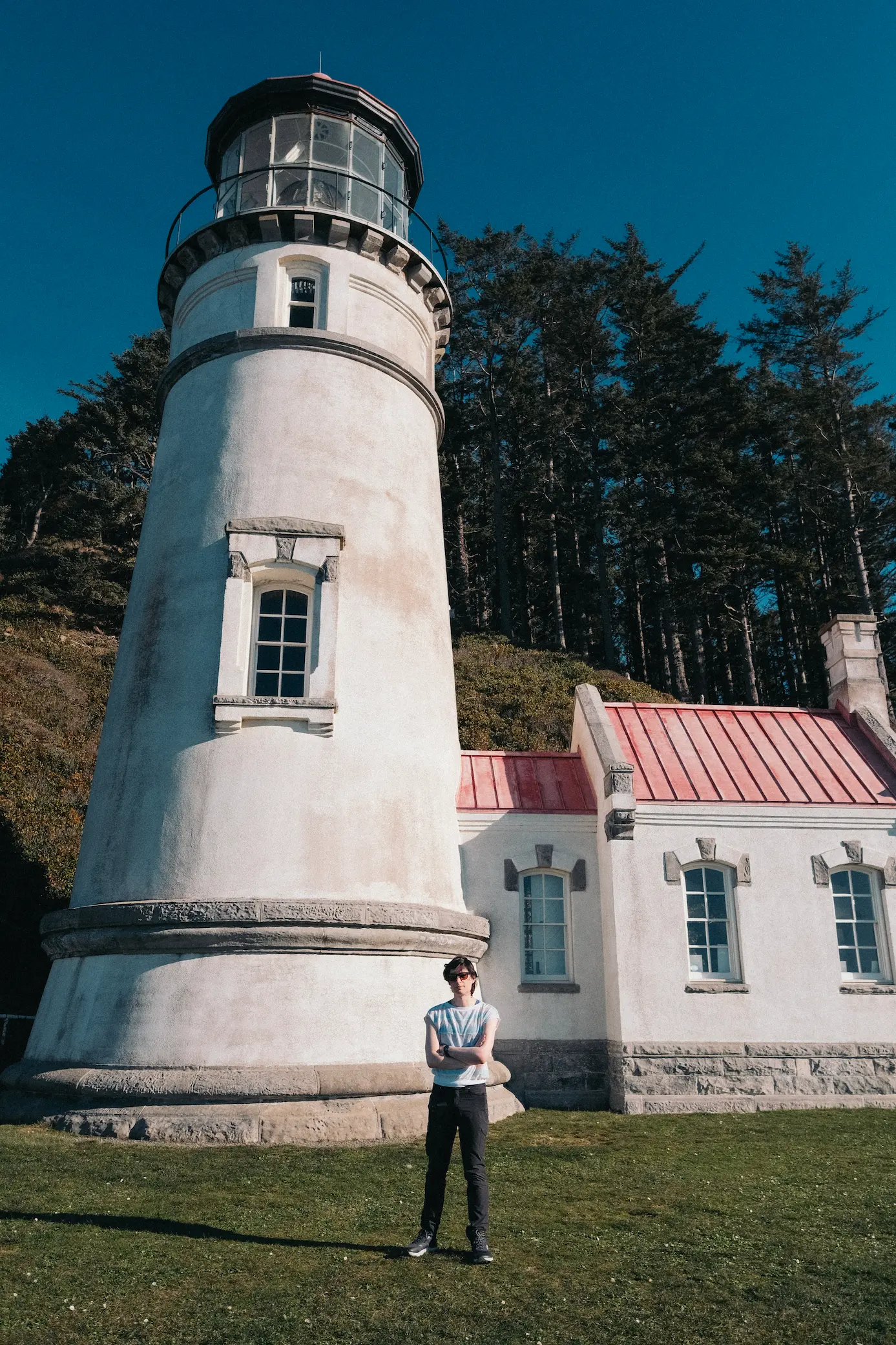 Photo of person in front of lighthouse