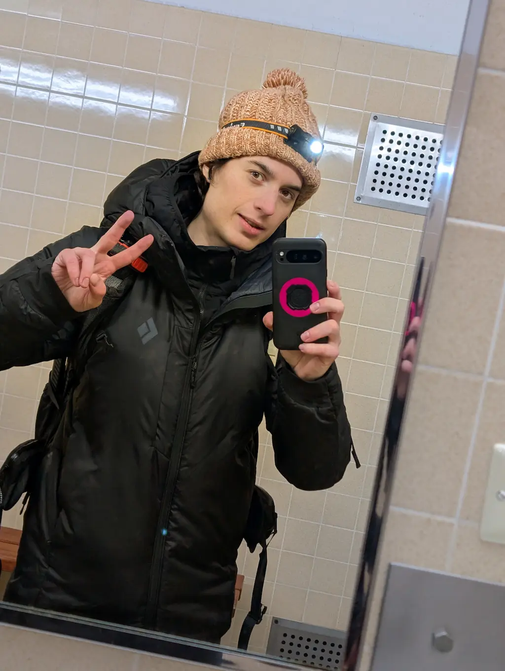 Selfie of a person using a peace sign