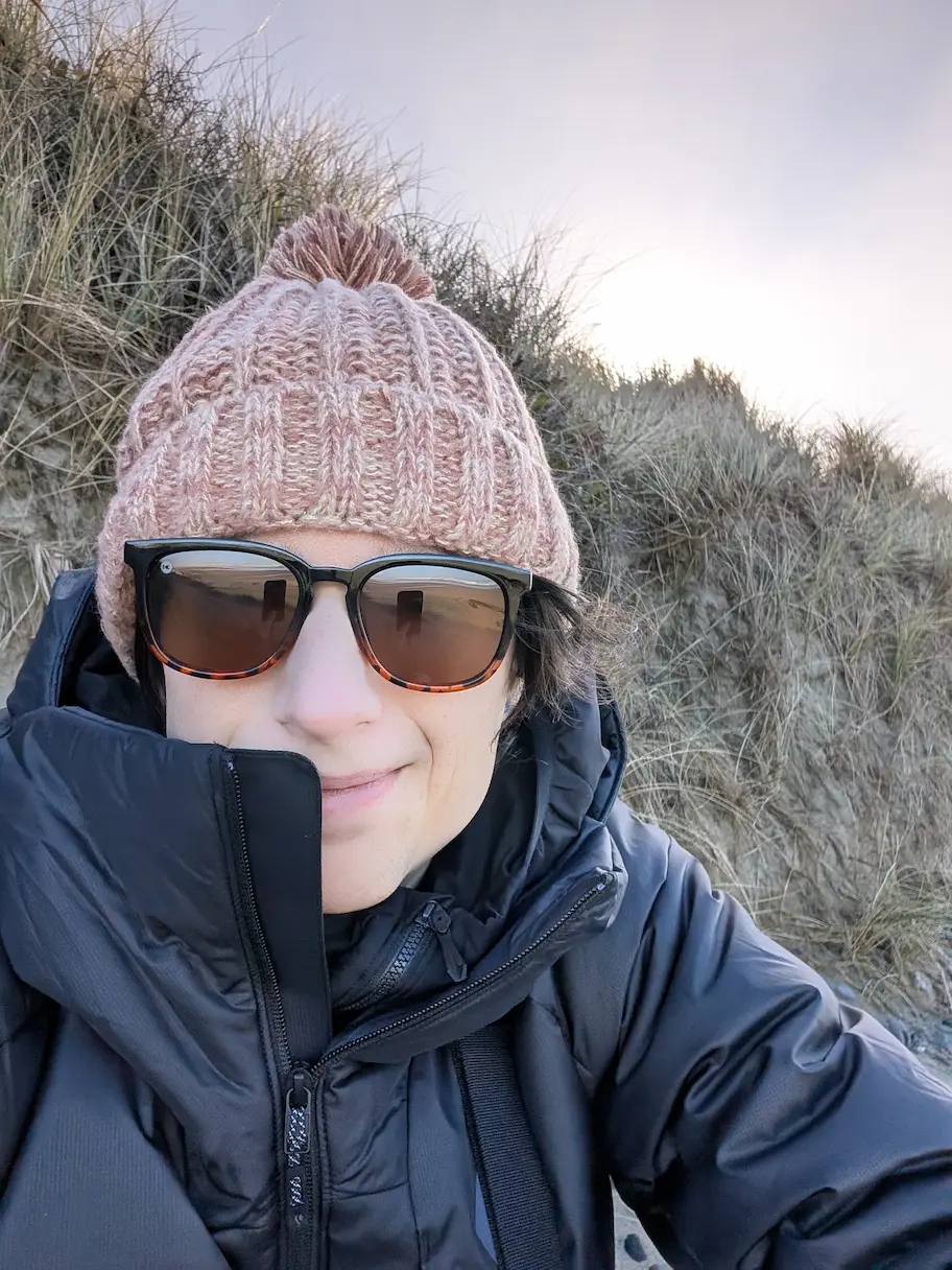 selfie of a person wearing sunglasses and a beanie