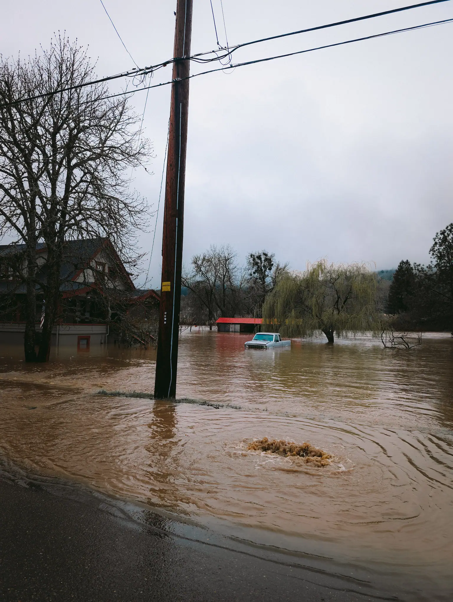 flooded street and yard in southern oregon