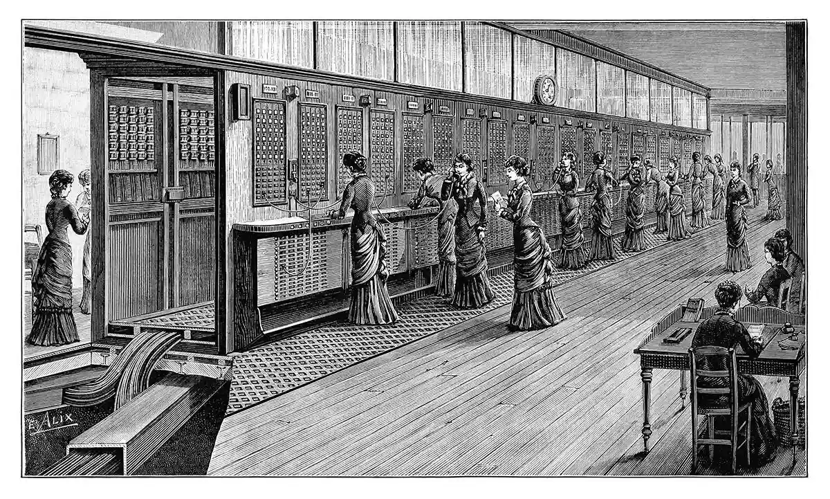 Perspective view of the Parisian central telephone office and exchange of avenue de l'Opéra, showing a host of busy switchboard operators and a cutaway depiction of the cables running beneath the floor, down to the basement, to connect to the rosace room. At the time the book was written, this particular office employed an all-female staff, including thirty-three switchboard operators and a director. The caption reads in the original French: Bureau central téléphonique de l'avenue de l'Opéra.